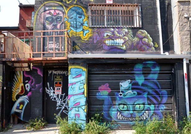 A smiling Cheshire Cat and a few other creatures.