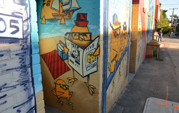 Part of the mural. Chickens are reading newspapers.