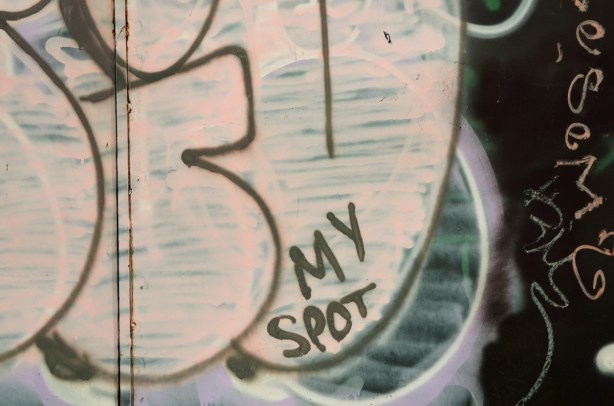 Black and white graffiti that says my spot