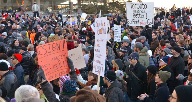 Protesters holding signs.