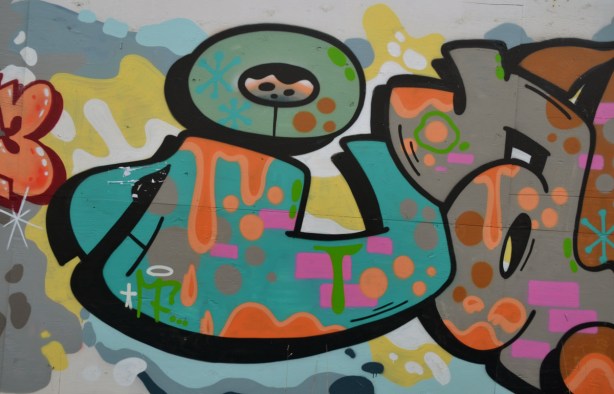 close up of part of a graffiti tag. Multicoloured.