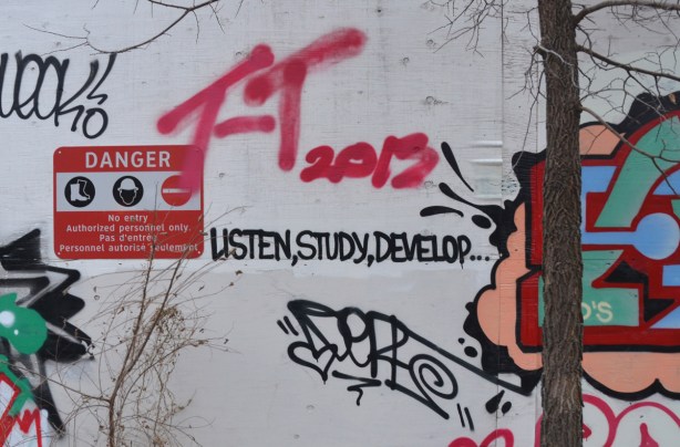 Graffiti of the words listen, study, develop