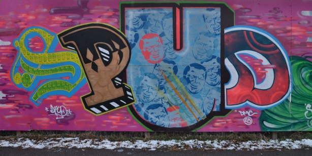 Spud graffiti tag on a pink background. Rob Ford faces fill the letter U. The S P and D are different colours