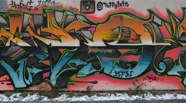 graffiti tag in blues and oranges