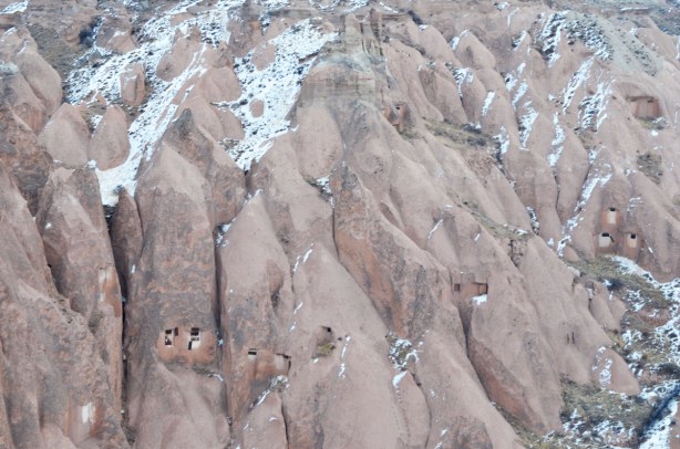 The hills of Cappadoccia are filled with caves. You can just see some of the holes in the rock in this photo. Some of the holes are natural and others are man made - the locals encourage pigeons to roost there so they can collect the guano to use as fertilizer in their fields.