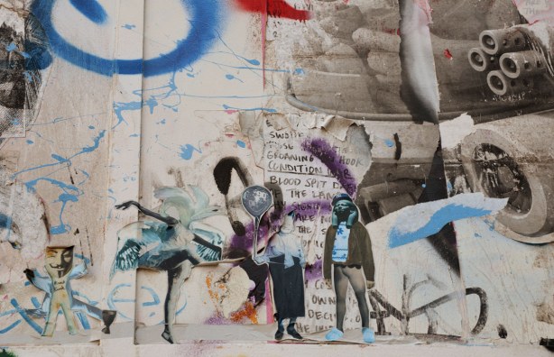 little people stuck to the wall, sticker street art on Kensington