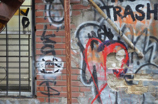 graffiti in an alley near Rue St. Laurent in Montreal, red heart and tags
