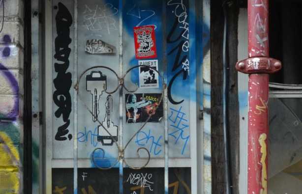graffiti in an alley near Rue St. Laurent in Montreal, paste ups, sticker, and metal hearts