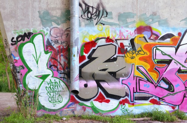 tags around a down spout, Bathurst St. over Cedarvale Park, graffiti under the bridge