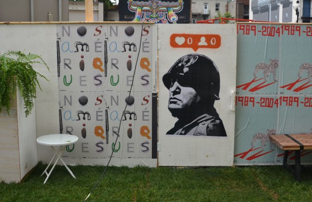 larger than life black and white picture with the instagram heart symbol on orange background for number of likes for that picture  and 