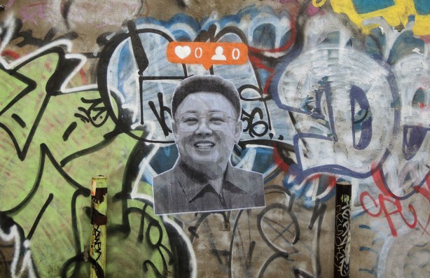 larger than life black and white picture with the instagram heart symbol on orange background for number of likes for that picture