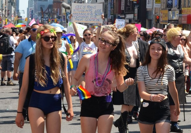 Three girls are walking in the parade