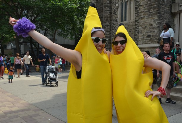 Two women in banana costumes posing for the camera.  