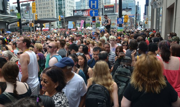 Wall to wall people at the intersection of Yonge and Dundas.  All you can see in the photo are people's heads. 