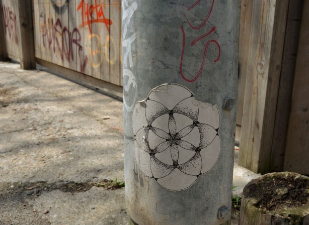 black and white line drawing that looks like something you'd create with spirograph 