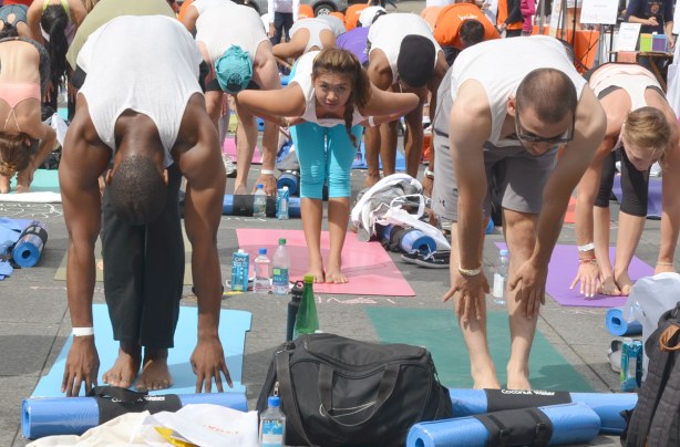 Group of people at 2014 yogathon, Dundas Square