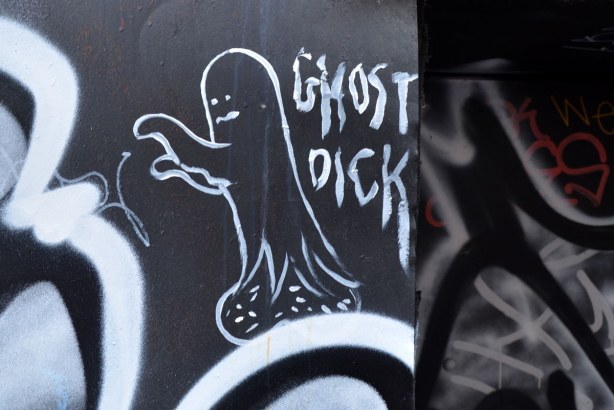 Ghost Dick are the words in the graffiti and they are accompanied by a white drawing of a ghost walking to the left with it's arms in front 