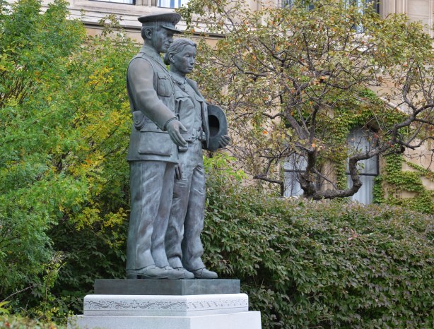 The two statues on the police memorial as seen from the side.