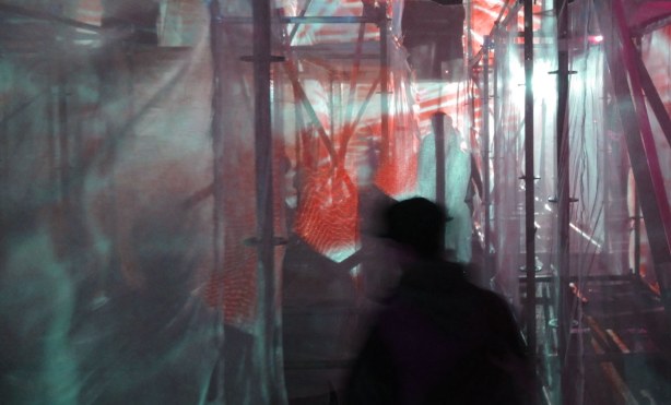 the amazing maze, made from a frame of metal bars wrapped in transparent gauze like fabric.  Coloured lights shine through the maze and the colours change frequently, purples, blues, yellows and reds.