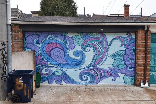 street art on a garage door - paisley shapes in blues and purples