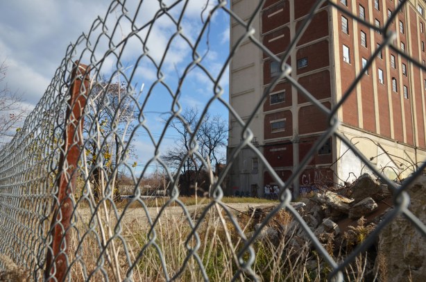 Chainlink fence in front of the building. 