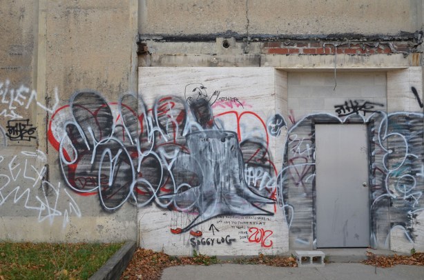 a tag over old graffiti