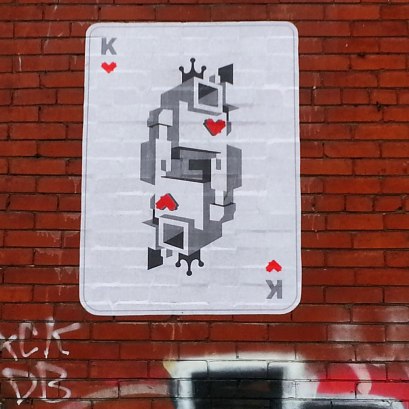Lovebot now looks like he's been made into the king of hearts on a playingcard. On a brick wall.