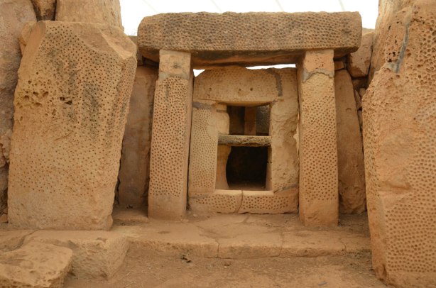 megalithic limestone blocks form a wall and doorway at a prehistoric site in Malta