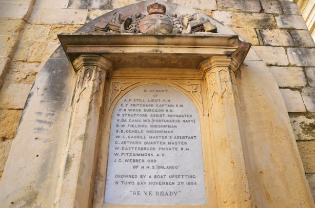 Memorial to sailers who drowned in the Mediterranean Sea in 1864, names carved on a plaque in stone.