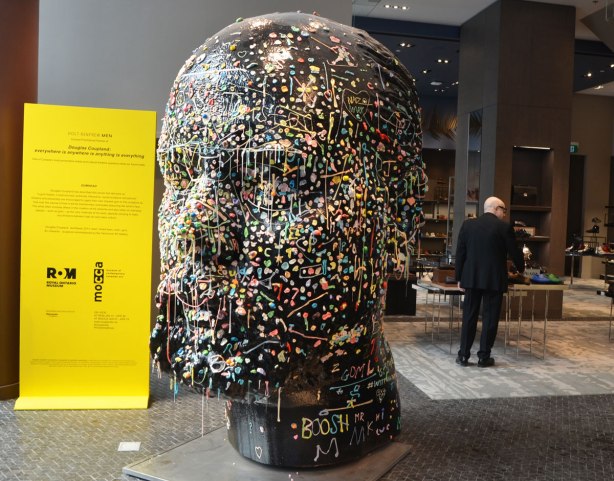 Douglas Coupland's 'Gumhead' inside Holts For Men store in Toronto. It is a very large black sculpture of a man's head to which people have been attaching gobs of chewed gum.