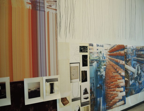 close up of part of a large collage art piece on a wall