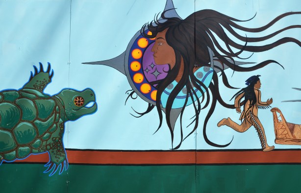 part of an Anishnawbe First Nations story/legend themed mural painted on wood construction hoardings in Allan Gardens
