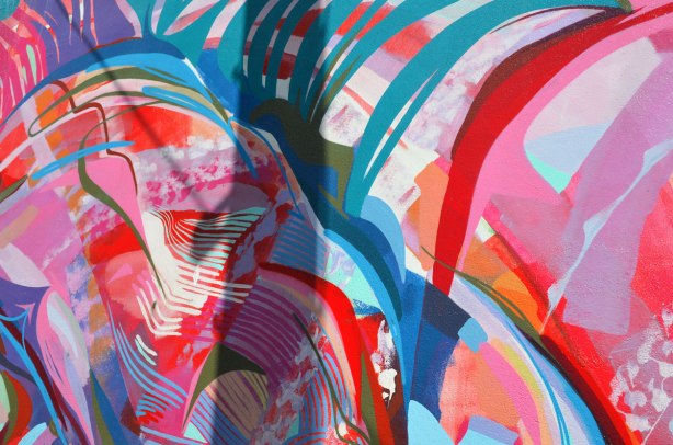 Close up of the brightly coloured strands of wool in the mural under the beltline on Dufferin Street