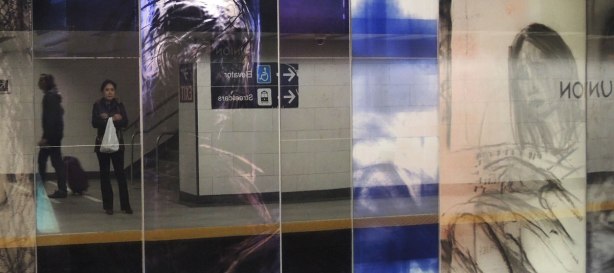 new art, pictures of people on the subway, on glass panels installed at Union Station platform - several panels with pictures of people but it is highly reflective so you can see the people waiting on the platform as well 