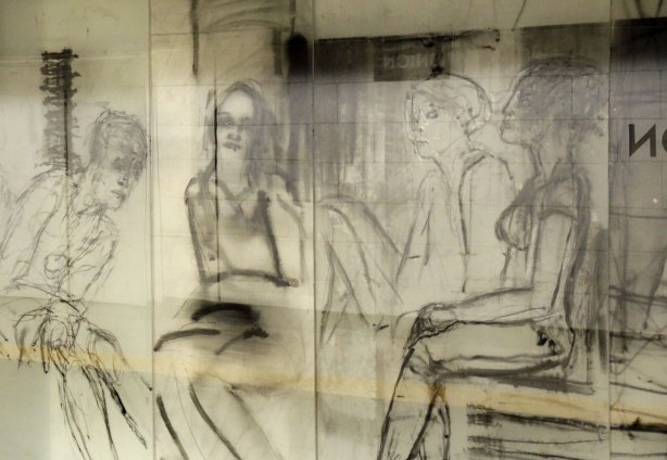 new art, pictures of people on the subway, on glass panels installed at Union Station platform