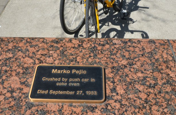 A black and brass plaque commemoration Marko Pejic who died in 1983