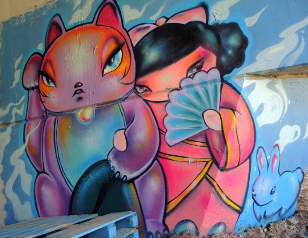 graffiti painting - Lovecat and a Japanese girl in pink kimono hiding her face behind a blue fan.  A cute little blue bunny is in the bottom right.