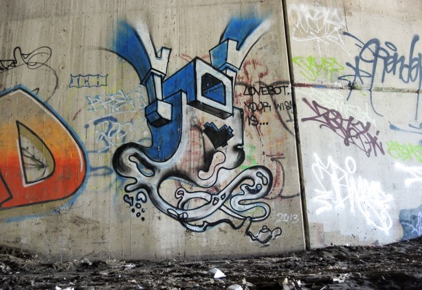 lovebot genie painting on a concrete wall.  