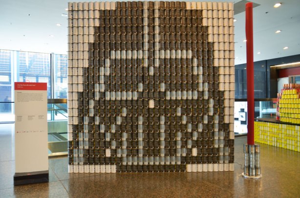 sculptures on display that were entered in a contest in support of the Daily Food Bank, sculptures made of canned food in a theme pertaining to hunger awareness - a large picture of Darth Vader's head