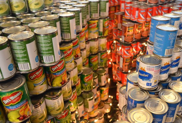 sculptures on display that were entered in a contest in support of the Daily Food Bank, sculptures made of canned food in a theme pertaining to hunger awareness - close up of a representation of the brain with a string of little lights representing the brain at work