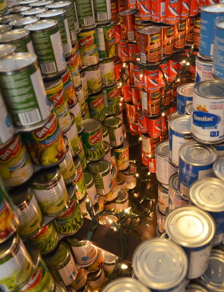 sculptures on display that were entered in a contest in support of the Daily Food Bank, sculptures made of canned food in a theme pertaining to hunger awareness - close up of a representation of the brain with a string of little lights representing the brain at work