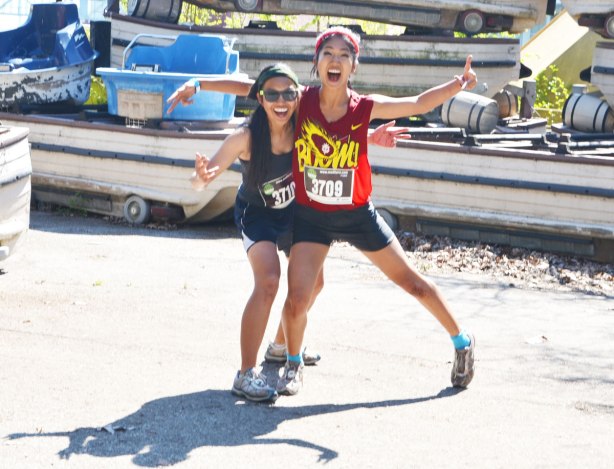 Two young women, mud hero participants, pose for the camera