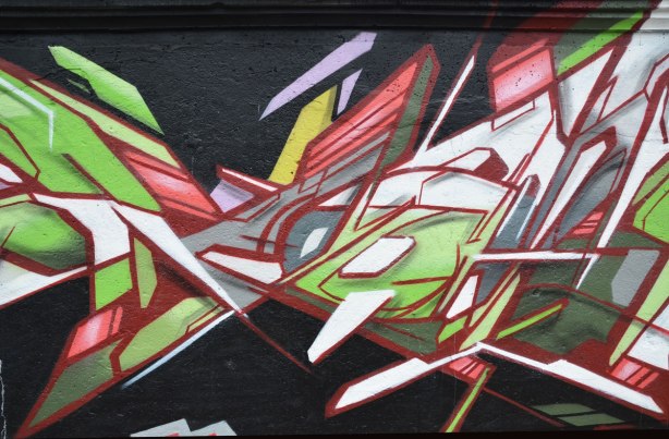 street art painting in geometrics, especially trianges and angled lines. 