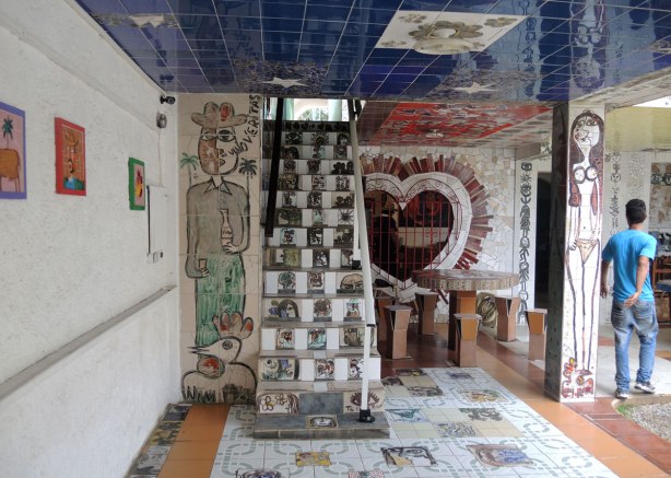 floor, walls and stairs covered with tile mosaics