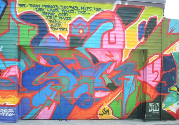 graffiti and street art in Graffiti Alley in Toronto - brightly coloured painting in many colours and shapes