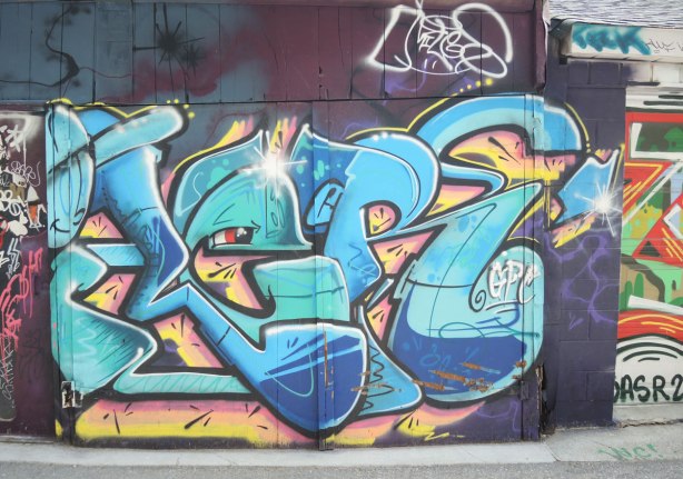 graffiti and street art in Graffiti Alley in Toronto - blue lettering, G P C 
