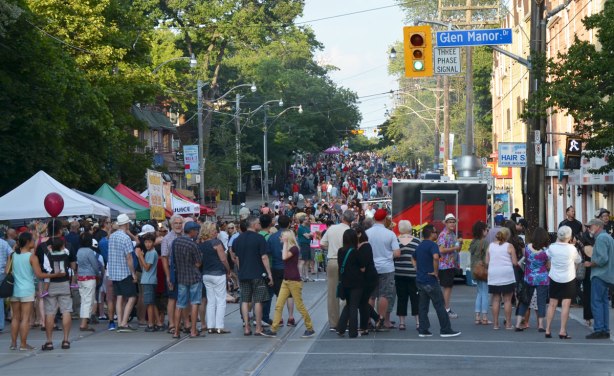 A crowd is on Queen St in Toronto as they have come to listen to live music as part of streetfest at the beach, intersection with Glen Manor Road