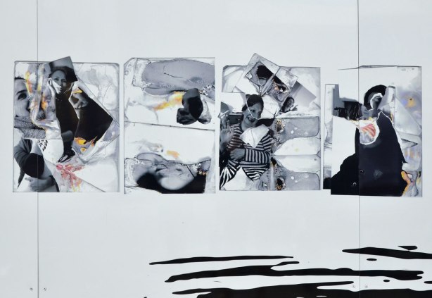 Artwork in grey tones using pieces of photographs of two women, mother and daughter, It is printed on white and displayed outdoors on a wall. It is called Blocked! and the artist is Ghazaleh Baniahmad