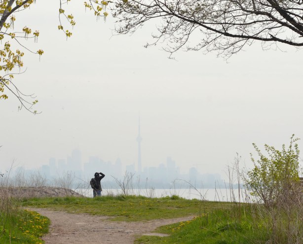 looking across a hazy Lake Ontario to the TOronto skyline