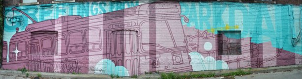 Greetings from Parkdale mural in light blue and purple featuring a ttc streetcar in shades of purple